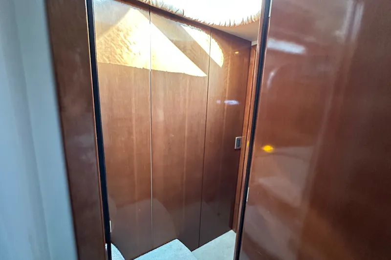 Slide: The Image of Interior of 2007 Meridian 411 Sedan with polished wooden walls and soft lighting. - 81