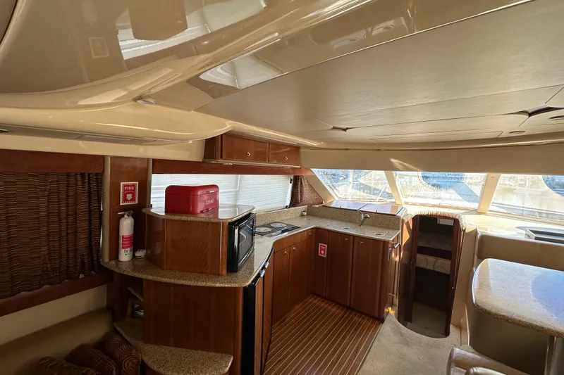 Slide: The Image of Luxurious interior of a 2007 Meridian 411 Sedan yacht with modern kitchen amenities. - 119