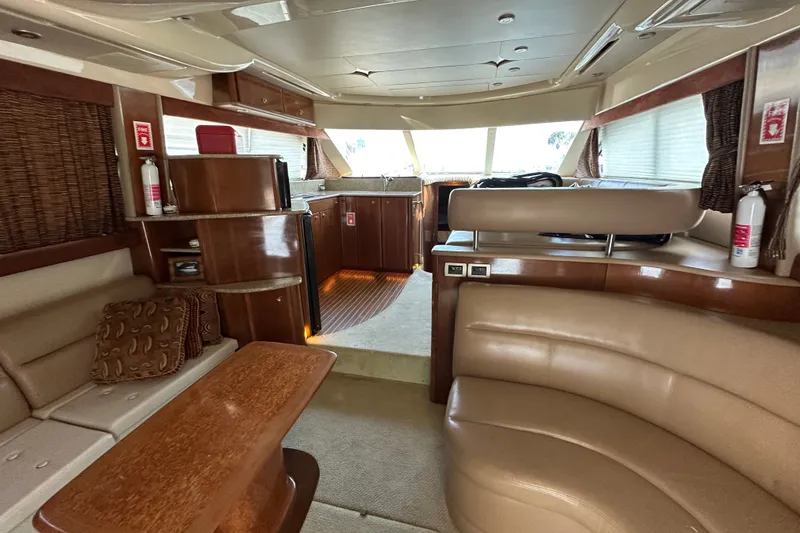 Slide: The Image of Luxurious interior of a 2007 Meridian 411 Sedan yacht with elegant wood finishes. - 45