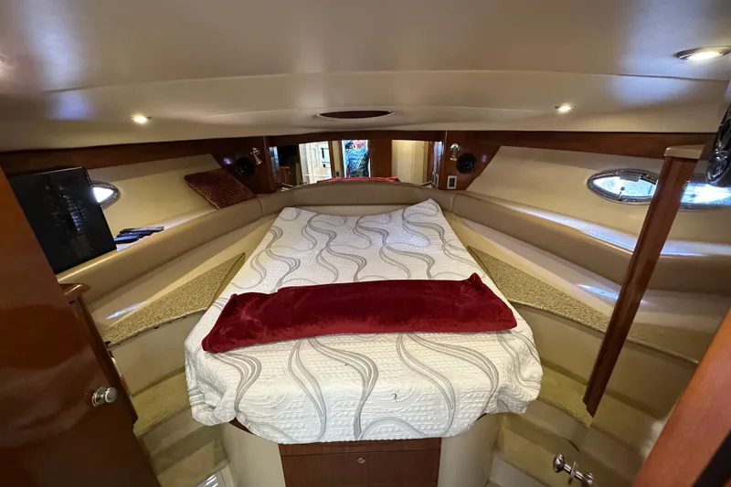 Slide: The Image of Luxurious cabin interior of a 2007 Meridian 411 Sedan yacht with cozy bedding. - 93