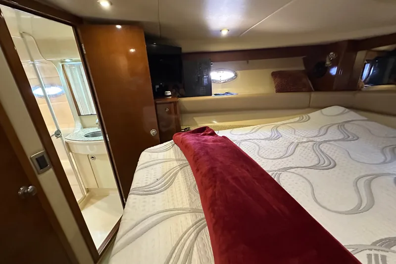 Slide: The Image of Luxurious cabin interior of 2007 Meridian 411 Sedan yacht with bed and ensuite bathroom. - 99