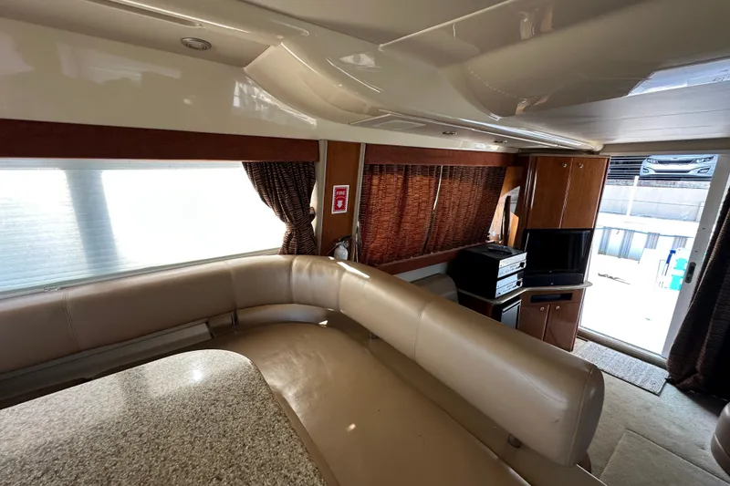 Slide: The Image of Interior of a 2007 Meridian 411 Sedan yacht with leather seating and entertainment area. - 115