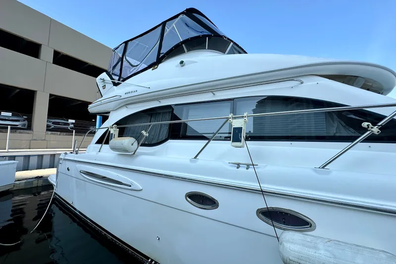 Slide: The Image of 2007 Meridian 411 Sedan yacht docked at marina, side view. - 20