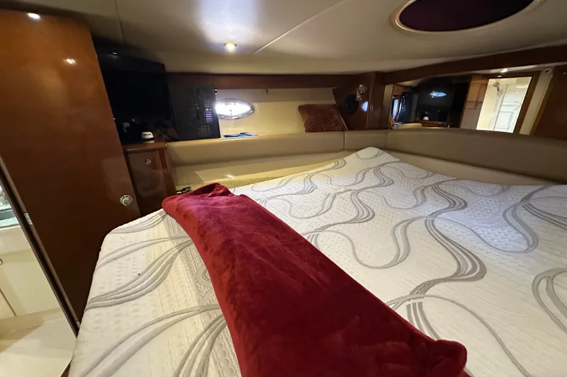 Slide: The Image of Luxurious bedroom interior of a 2007 Meridian 411 Sedan yacht with elegant bedding. - 100