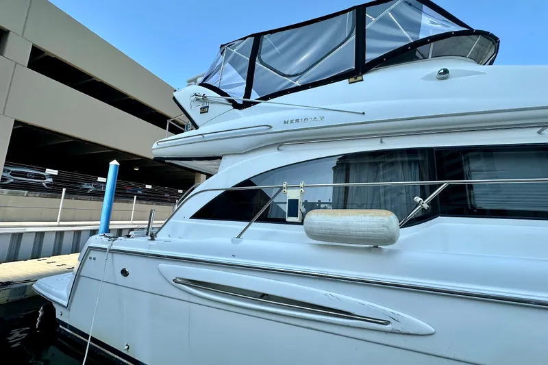 Slide: The Image of 2007 Meridian 411 Sedan yacht docked at marina, side view. - 21