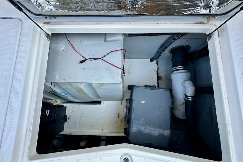 Slide: The Image of Engine compartment of a 2007 Meridian 411 Sedan with visible wiring and components. - 35