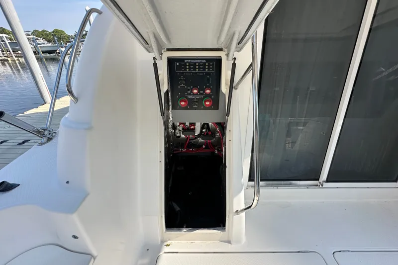 Slide: The Image of 2007 Meridian 411 Sedan boat interior with control panel, docked at marina. - 113