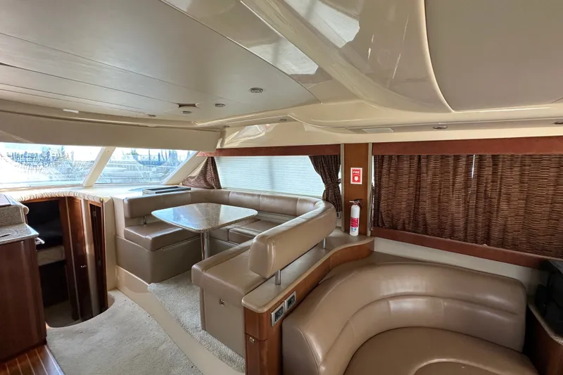 Slide: The Image of Luxurious interior of a 2007 Meridian 411 Sedan yacht with leather seating and dining area. - 58