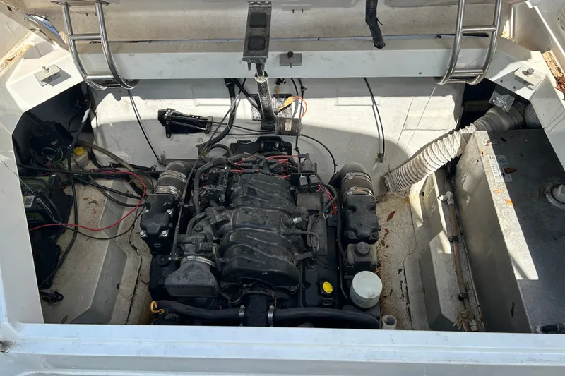 Slide: The Image of Engine compartment of a 1998 Cobalt 293 boat, showing detailed mechanical components. - 15