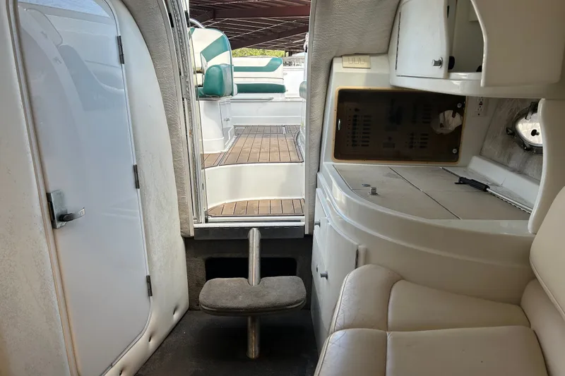 Slide: The Image of Interior view of a 1998 Cobalt 293 boat with seating and cabinetry. - 13