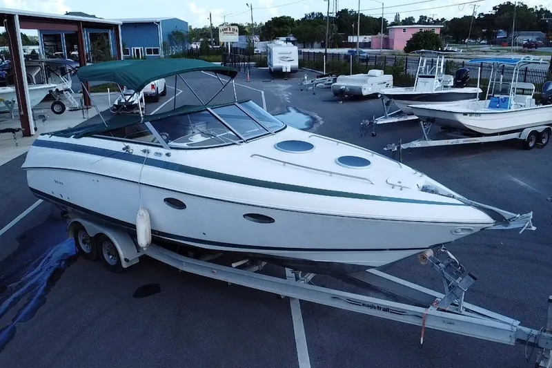 Slide: The Image of 1998 Cobalt 293 boat on trailer in marina parking lot. - 5