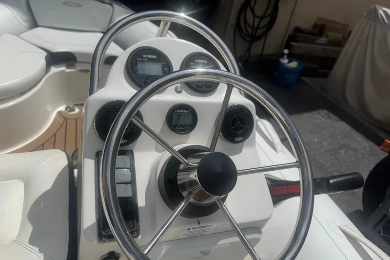 Slide: The Image of Steering console of a 2020 Zodiac Yachtline 440 with Yamaha controls and gauges. - 6