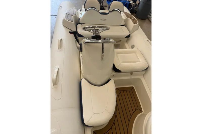Slide: The Image of 2020 Zodiac Yachtline 440 interior with white seating and steering console. - 7