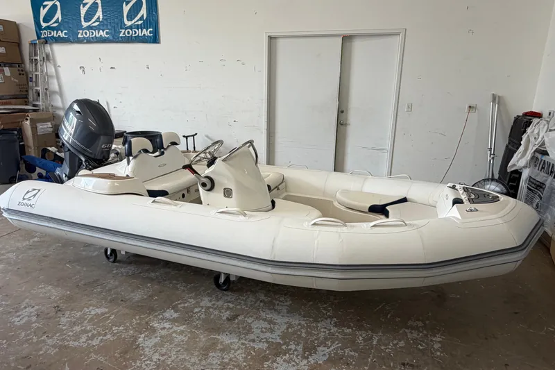 Slide: The Image of 2020 Zodiac Yachtline 440 inflatable boat in a garage setting. - 5