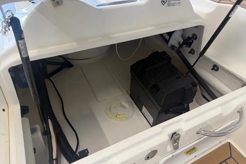 Slide: The Image of Storage compartment of 2020 Zodiac Yachtline 440 with battery and wiring. - 11