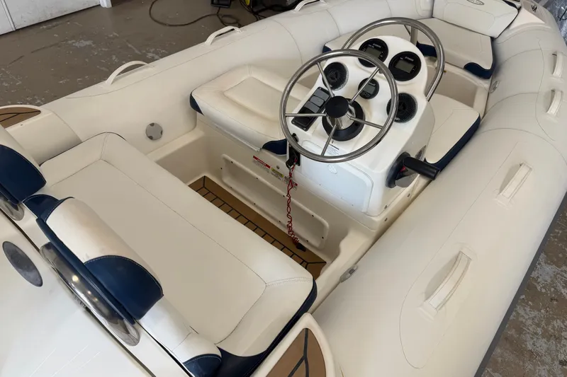 Slide: The Image of 2020 Zodiac Yachtline 440 inflatable boat interior with steering console and seating. - 3