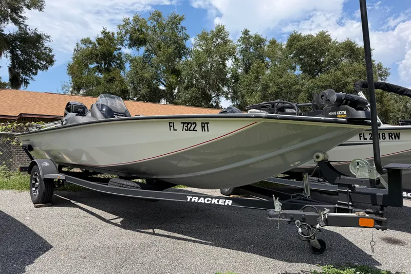 The Image of 2019 Tracker Pro Team 175 TXW Tournament Edition boat on trailer, parked outdoors. - 1