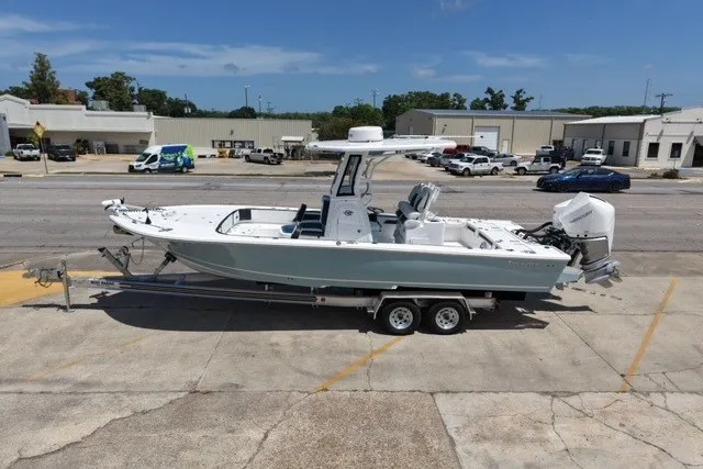 The Image of 2026 Tidewater 2700 Carolina Bay boat on trailer in parking lot. - 0