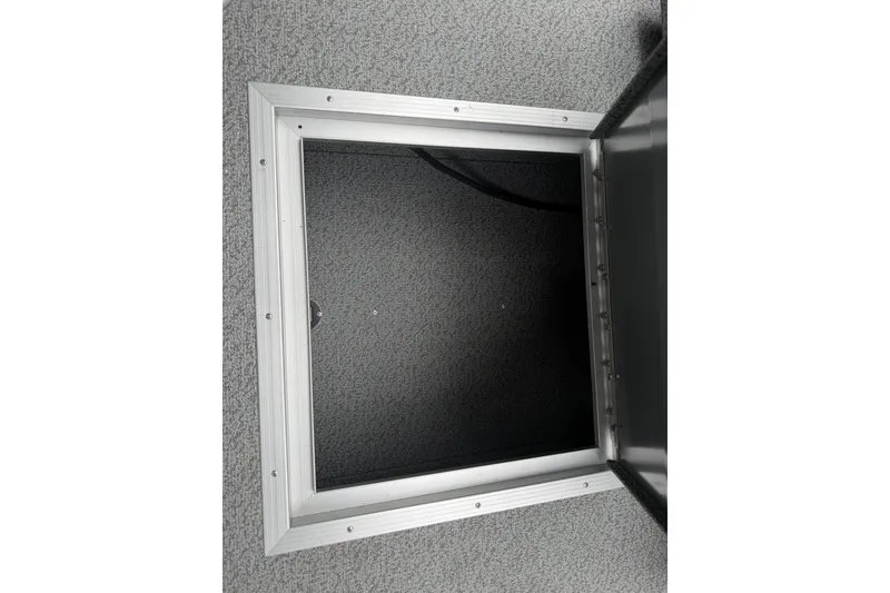 Slide: The Image of Open hatch on Starcraft Fishmaster 196 boat, 2027 model, with carpeted interior. - 11