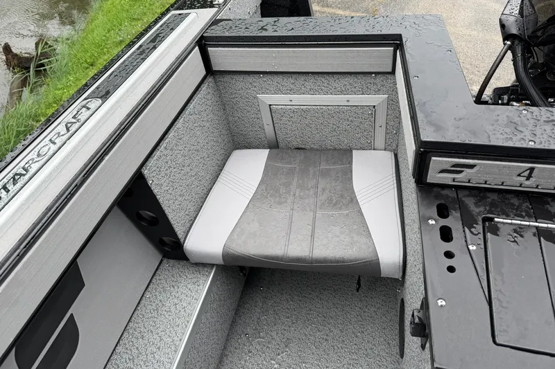 Slide: The Image of Starcraft Fishmaster 196 boat interior, featuring a cushioned seat with sleek design, 2027 model. - 22