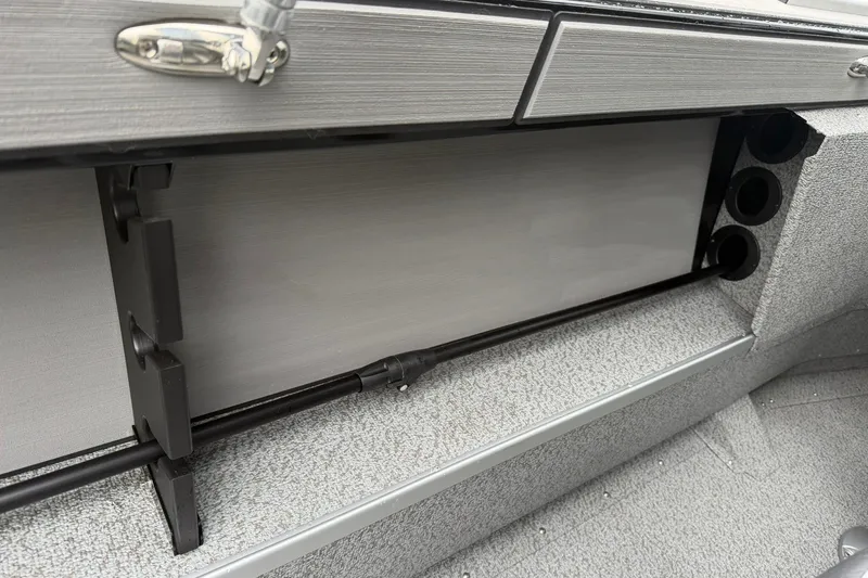 Slide: The Image of Interior view of a 2027 Starcraft Fishmaster 196 boat, showcasing storage compartment details. - 12