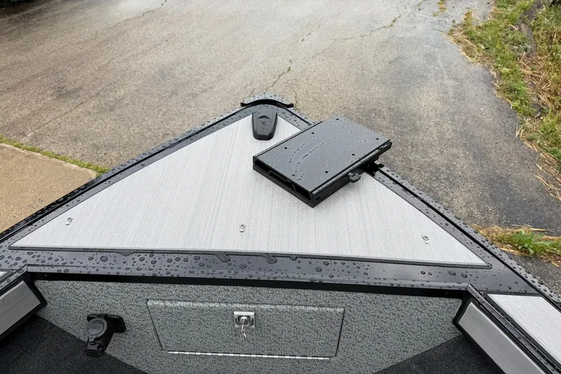 Slide: The Image of Bow of 2027 Starcraft Fishmaster 196 boat with raindrops on deck. - 26
