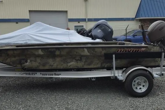 The Image of 2026 Havoc 1760 VJST boat on trailer, covered, parked outdoors. - 1
