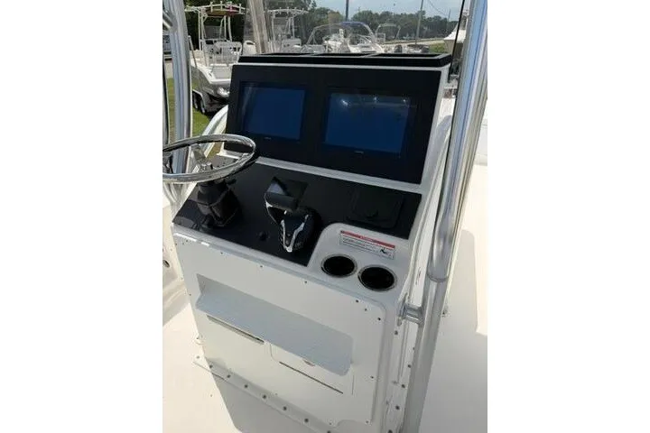 Slide: The Image of 2024 KenCraft 2460 Bayrider boat console with dual screens and steering wheel. - 25