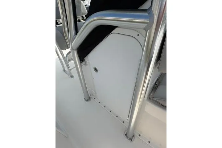 Slide: The Image of 2024 KenCraft 2460 Bayrider boat interior with sleek metal railings and white paneling. - 18