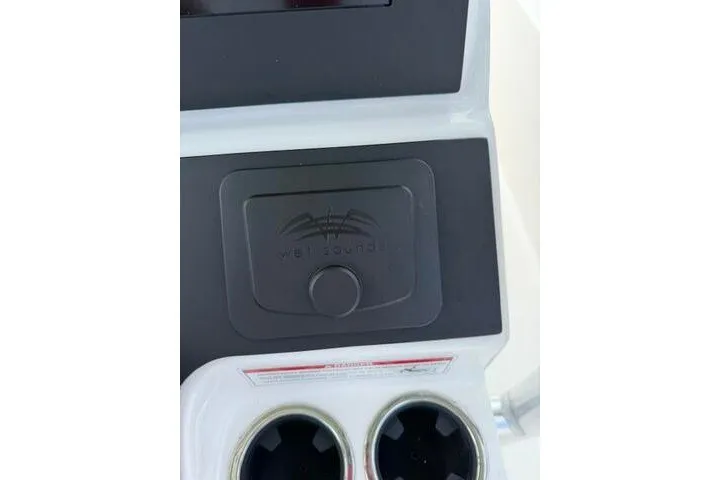 Slide: The Image of Control panel of 2024 KenCraft 2460 Bayrider boat with cup holders and audio system. - 28