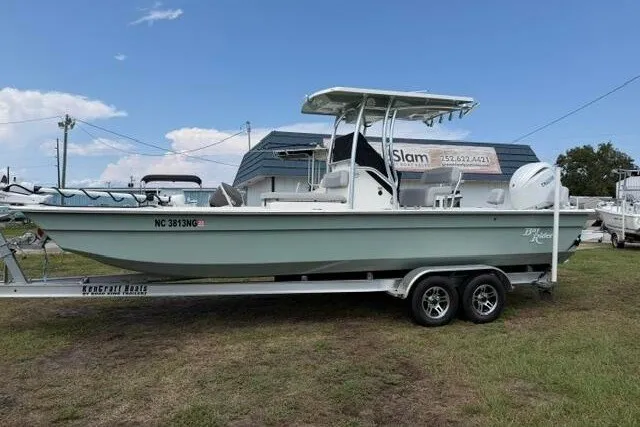 The Image of 2024 KenCraft 2460 Bayrider boat on trailer, parked outdoors under blue sky. - 1