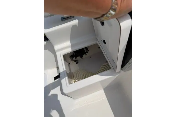 Slide: The Image of Open storage compartment on 2024 KenCraft 2460 Bayrider boat, showcasing interior details. - 22