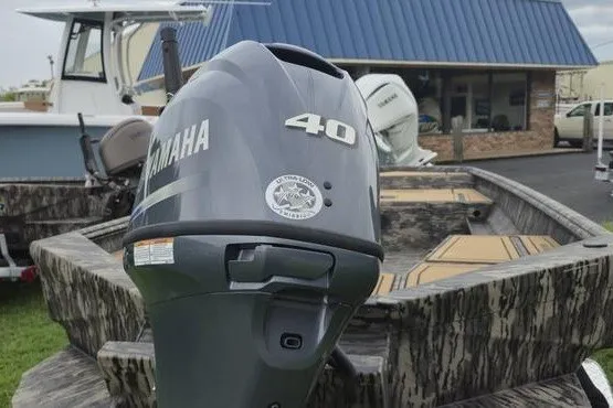 Slide: The Image of Outboard motor on Havoc 1656 MRST MACH 1 boat, 2027 model, in a marina setting. - 13