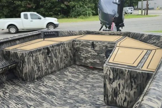 Slide: The Image of 2027 Havoc 1656 MRST MACH 1 boat interior with camouflage design and storage compartments. - 6