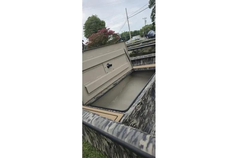 Slide: The Image of Open storage compartment of 2027 Havoc 1656 MRST MACH 1 boat, showcasing interior design. - 10