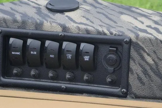 Slide: The Image of Control panel of 2027 Havoc 1656 MRST MACH 1 boat with labeled switches. - 4