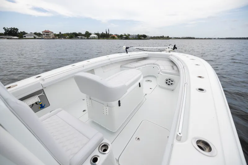 Slide: The Image of 2019 Yellowfin 36 Offshore boat interior with seating, on calm water. - 14