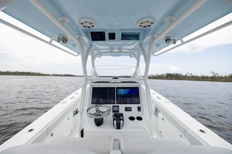 Slide: The Image of 2019 Yellowfin 36 Offshore boat interior with navigation system on open water. - 30
