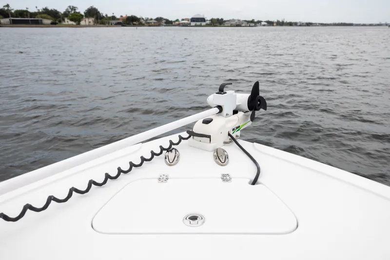 Slide: The Image of Bow of 2019 Yellowfin 36 Offshore boat with trolling motor on calm water. - 16