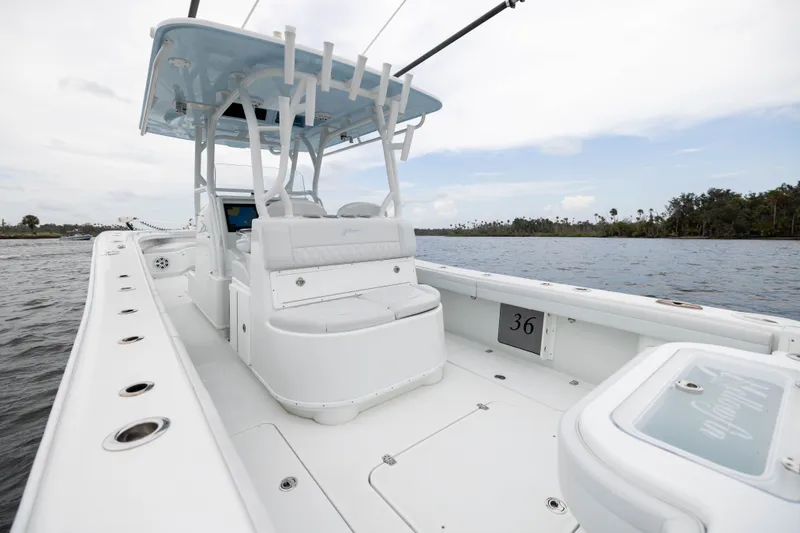 Slide: The Image of 2019 Yellowfin 36 Offshore boat interior, featuring spacious seating and sleek design on the water. - 37