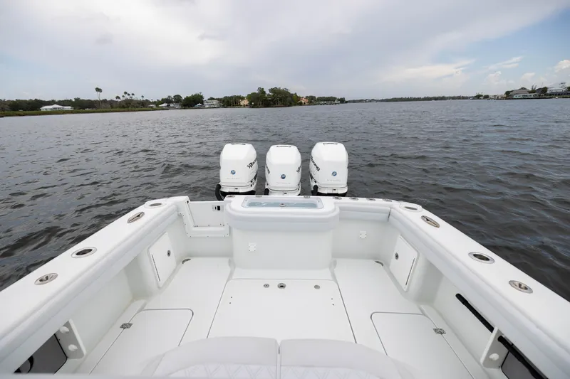 Slide: The Image of 2019 Yellowfin 36 Offshore boat with triple engines on calm water. - 42