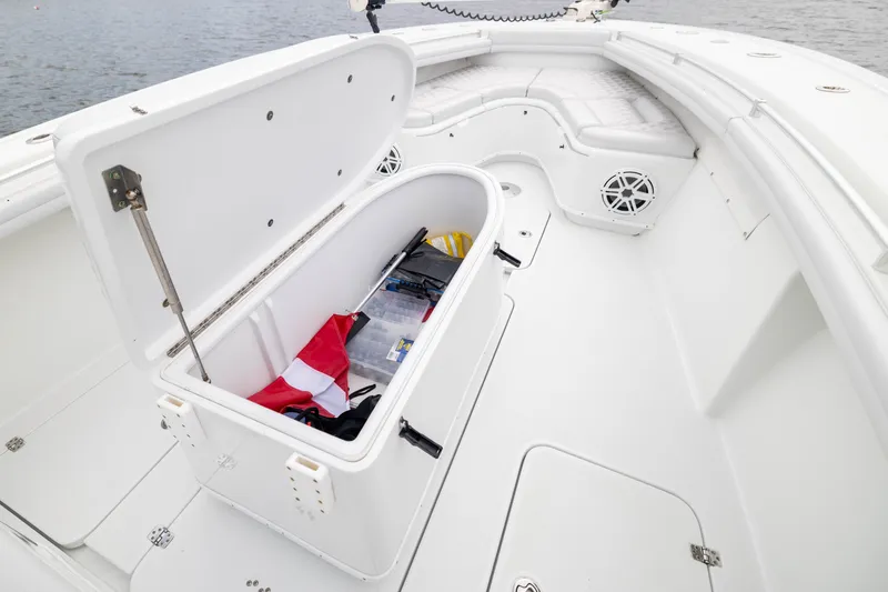 Slide: The Image of 2019 Yellowfin 36 Offshore boat with open storage compartment, revealing gear and accessories. - 20