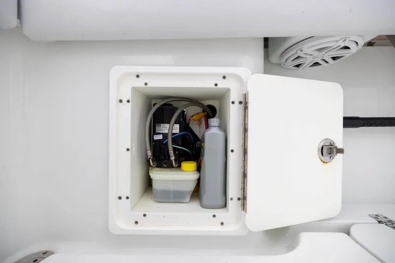 Slide: The Image of Storage compartment on a 2019 Yellowfin 36 Offshore boat, containing maintenance supplies. - 47