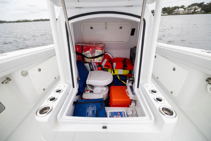 Slide: The Image of 2019 Yellowfin 36 Offshore boat storage with safety gear and equipment. - 23