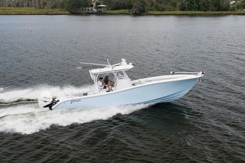 Slide: The Image of 2019 Yellowfin 36 Offshore boat cruising on open water. - 12