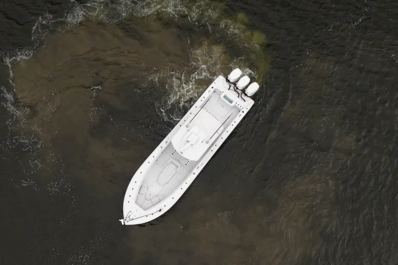 Slide: The Image of Aerial view of 2019 Yellowfin 36 Offshore boat on dark water. - 5