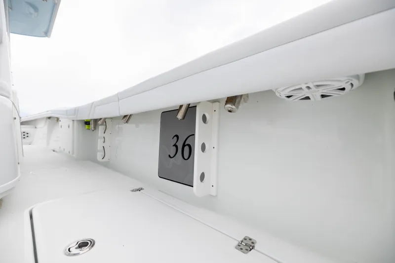 Slide: The Image of 2019 Yellowfin 36 Offshore boat interior with white deck and speaker. - 27