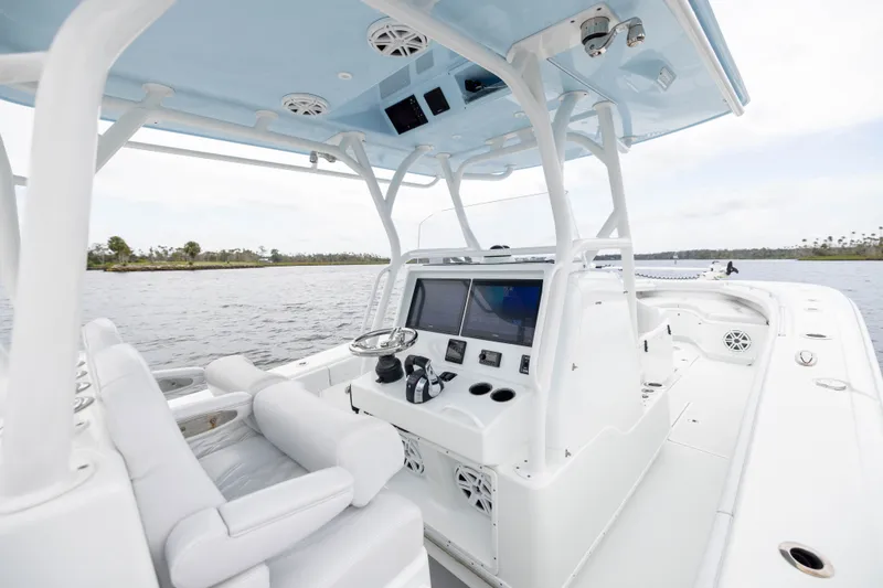 Slide: The Image of 2019 Yellowfin 36 Offshore boat interior with advanced navigation system and comfortable seating. - 28