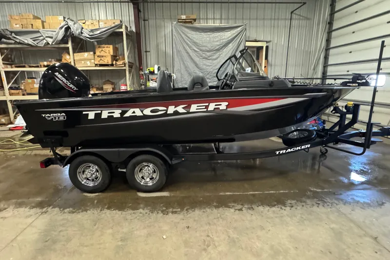 The Image of 2026 Tracker Targa V-18 Combo boat in a garage, side view. - 0