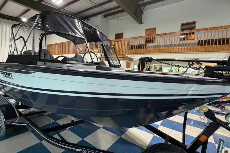 Slide: The Image of 2027 Starcraft Fishmaster 196 boat displayed indoors on a trailer. - 1